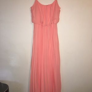 B. Smart coral pleated maxi dress .